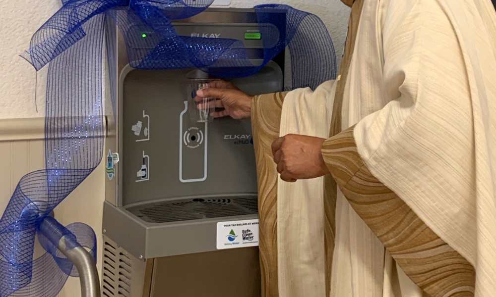 Fr. George fills his water bottle at the new the bottle refill station