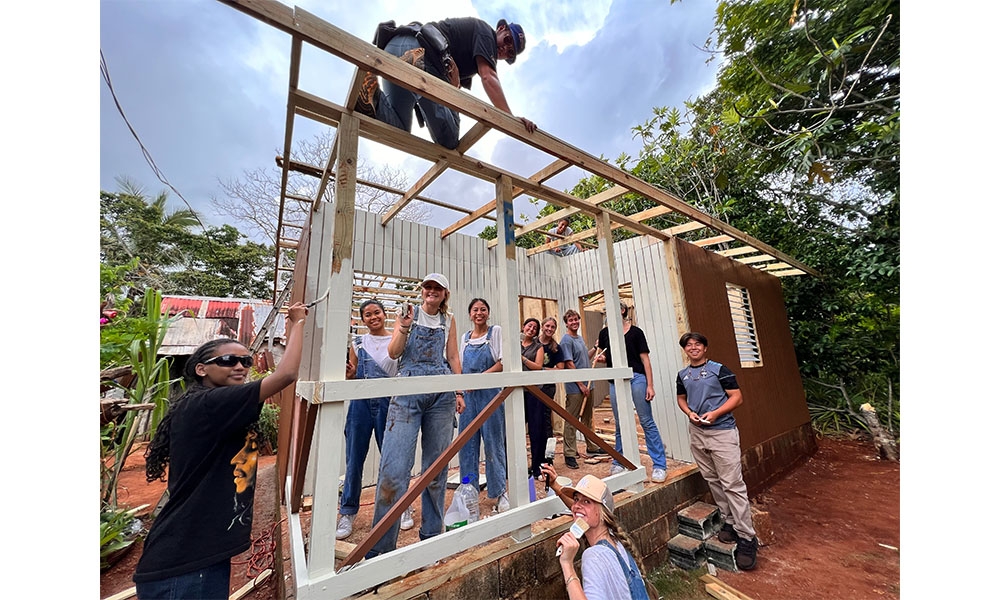 Students build studs of a house in Jamaica