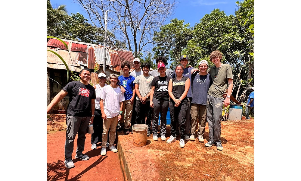 Student builders pose as a group