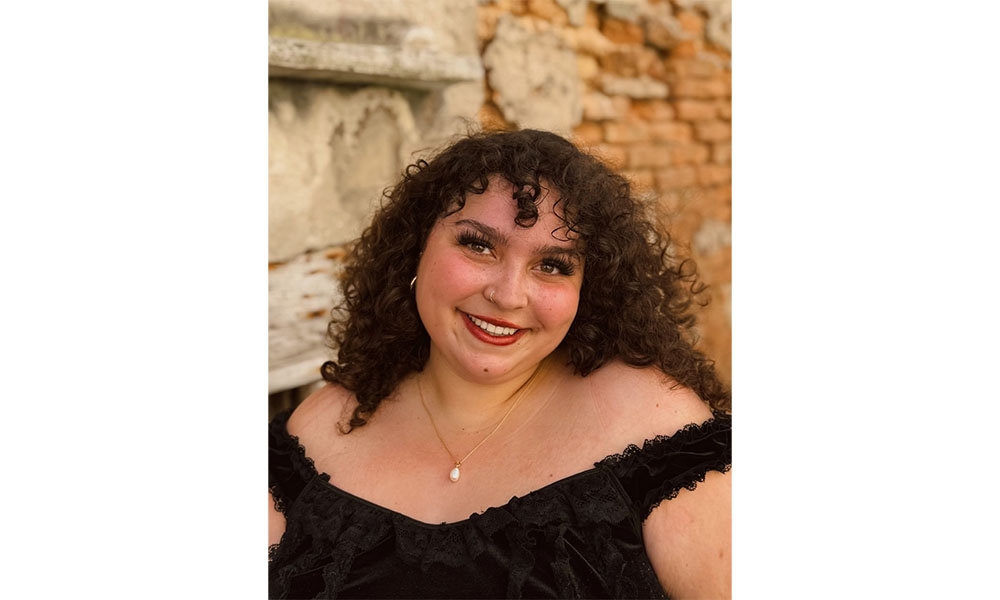 Headshot of London Guvan with stone background