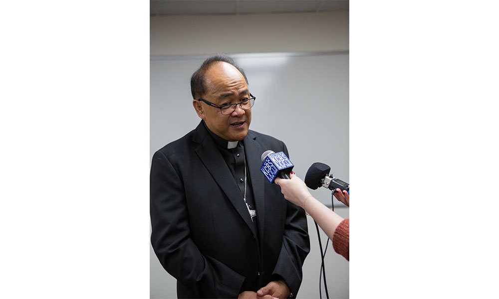 Bishop Elect Andy speaking into microphone