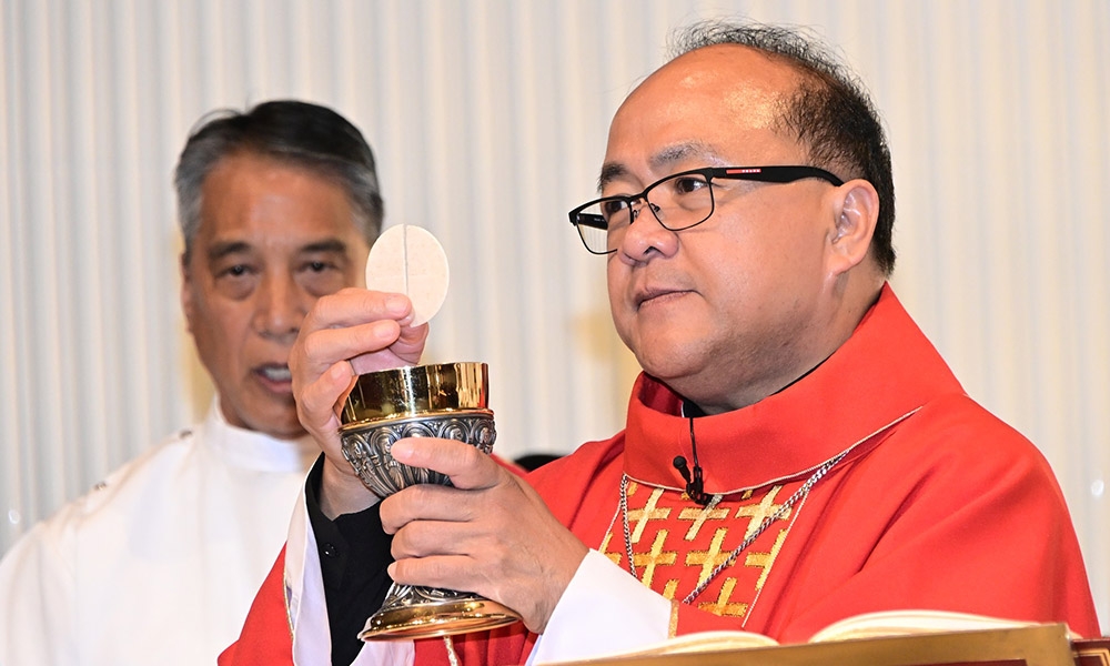 Bishop Ligot with Eucharist