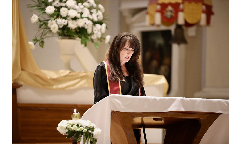 Tracey Colella at the podium giving her speech