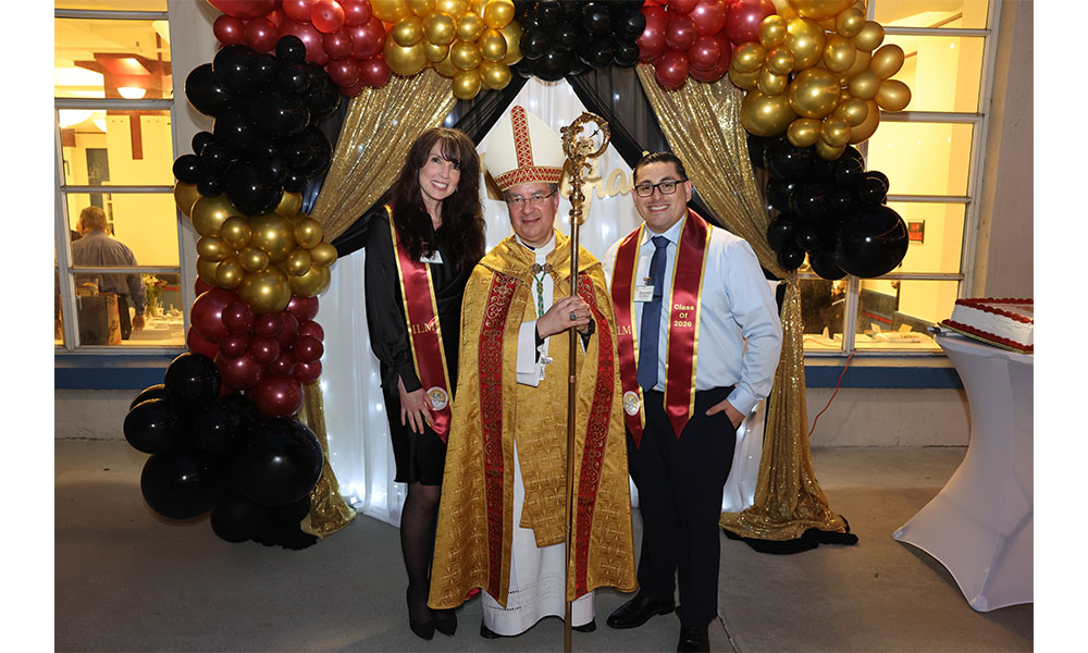Tracey and Salvador stand with Bishop Cantú