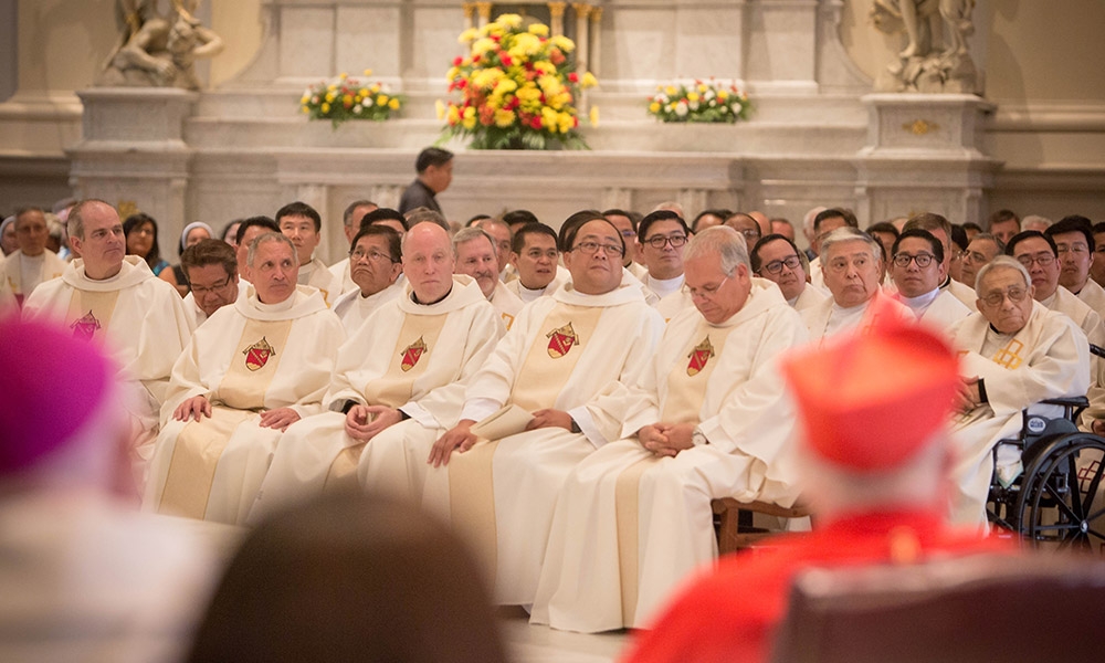 Bishop Andy sits in Cathedral Basilica