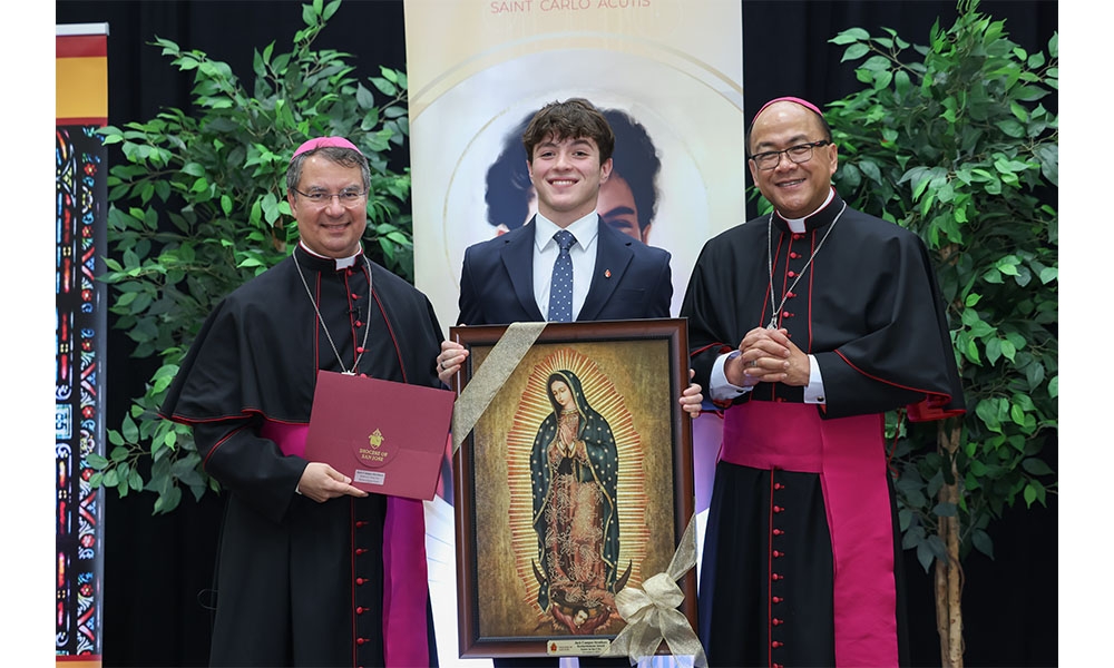 Jack holds frame photo of Our Lady of Guadalupe, stands between Bishops